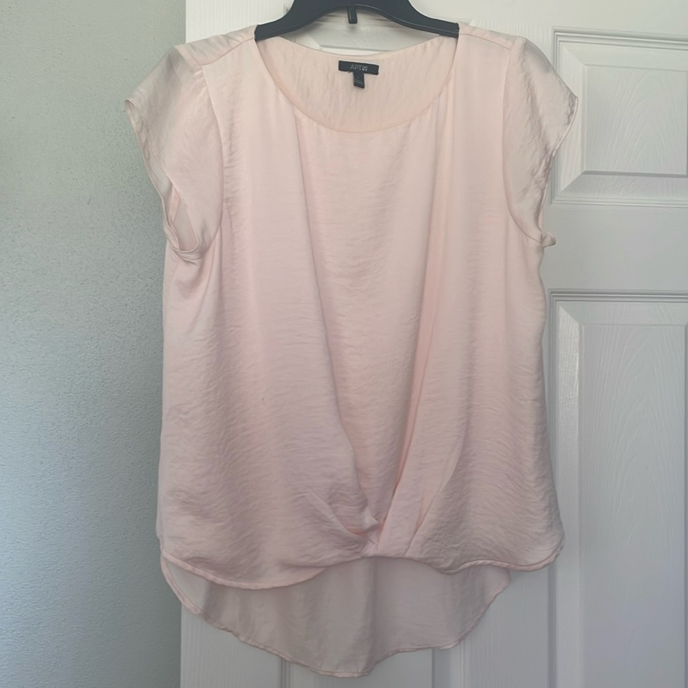 Beautiful pink crinkled cap sleeve top with gathered front and longer back.